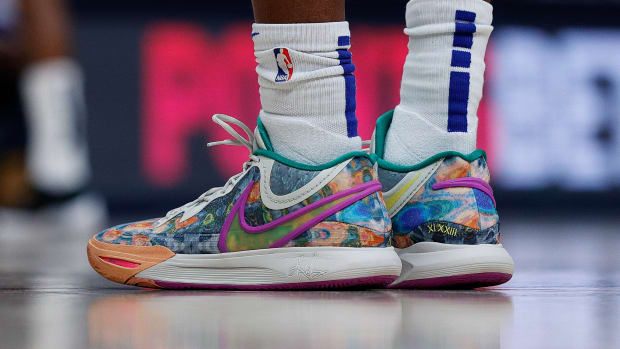 View of rainbow-colored Nike shoes.